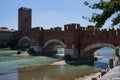 View of the Castel Vecchio Bridge connected to Castelvecchio Castle along Adige river in Verona, Italy - July, 2022 Royalty Free Stock Photo